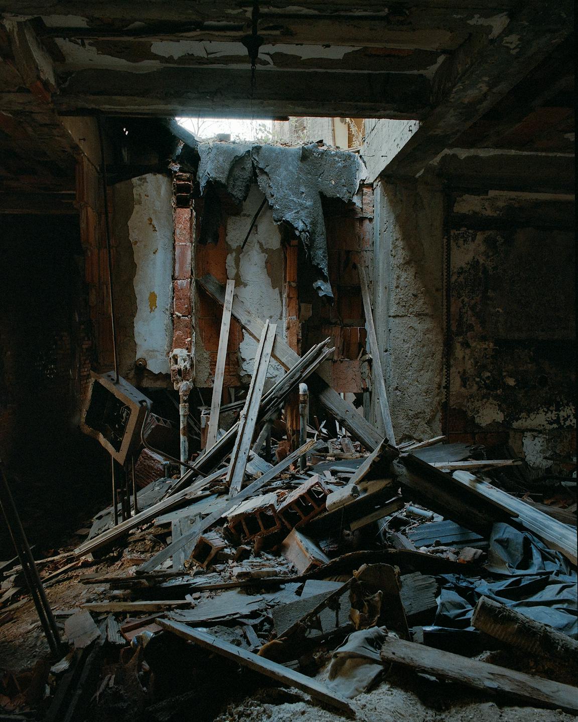 Beams and other forms of debris are spotlight by a beam of sunshine.